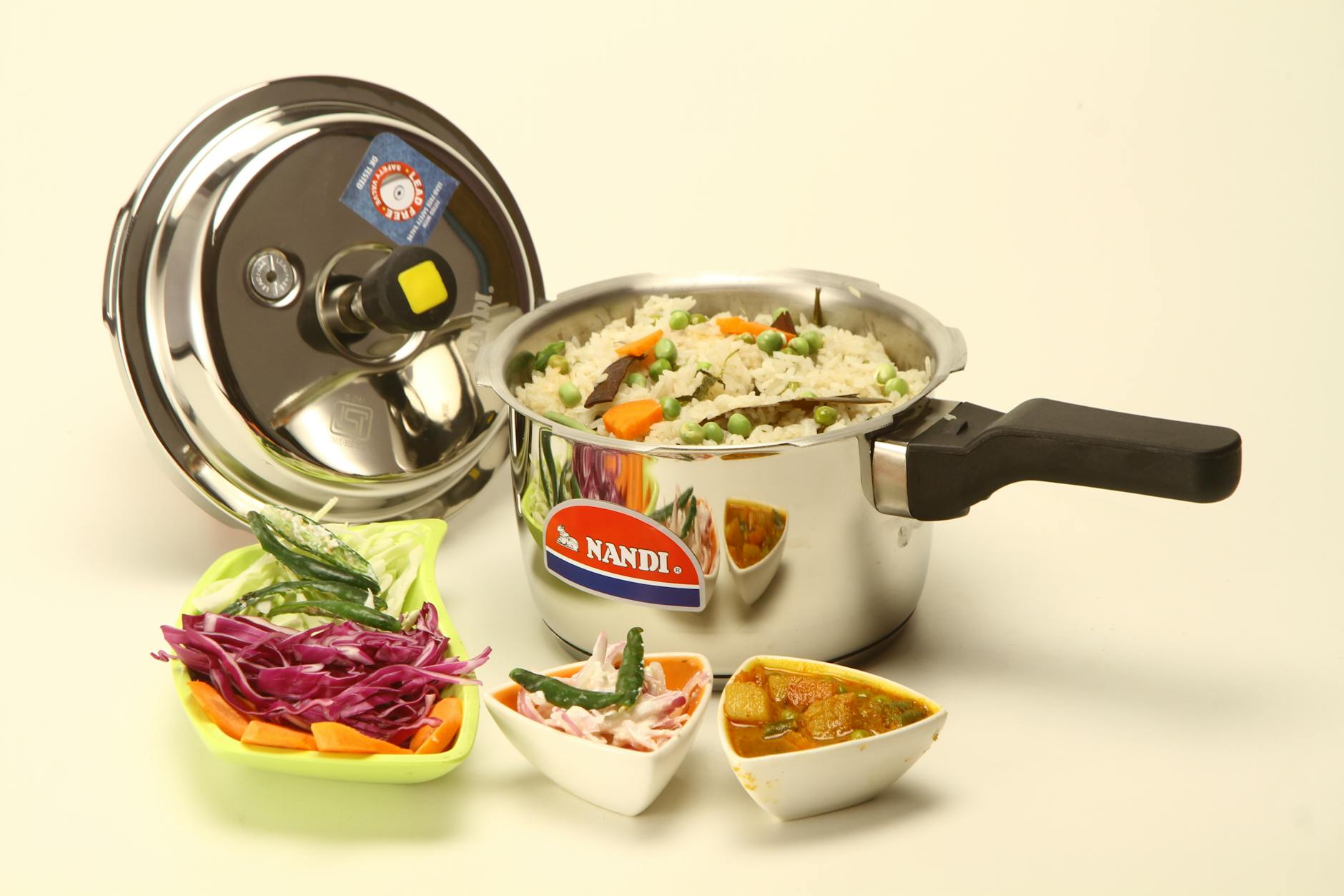 indian cuisine in pressure cooker on white background